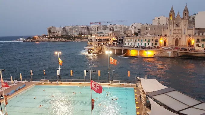 St. Julian’s Malta nightlife district at night, showing bars, clubs and busy streets